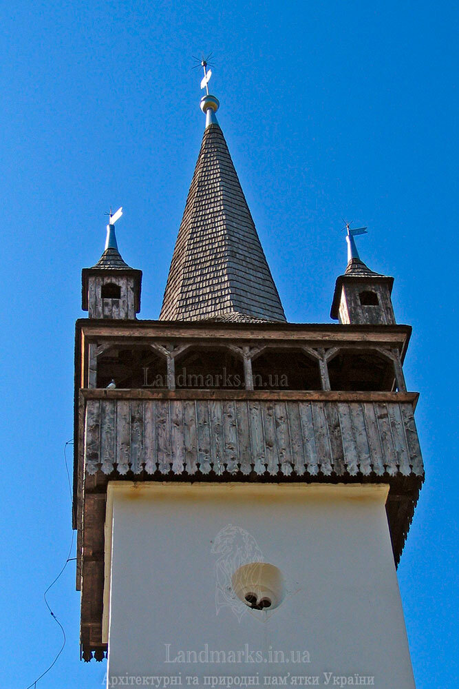 The gothic steeple of the bell tower of the church in Bene
